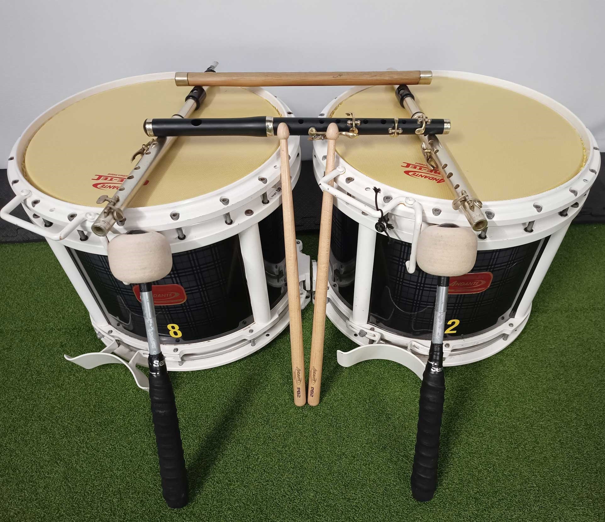 side marching drums sticks and flutes